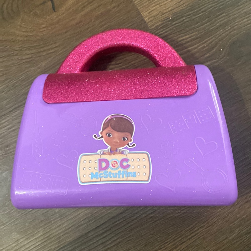 Doc McStuffins medical bag with a fake Band-Aid, and a stethoscope. 3 piece set